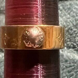 HOLD Louis Vuitton gold tone ring.